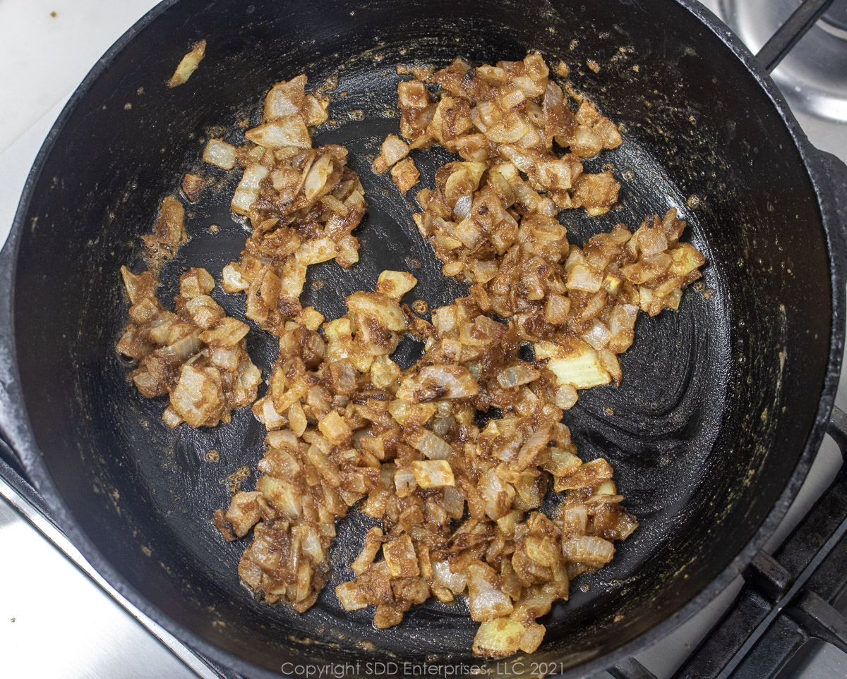 onions frying in a roux in a Dutch oven