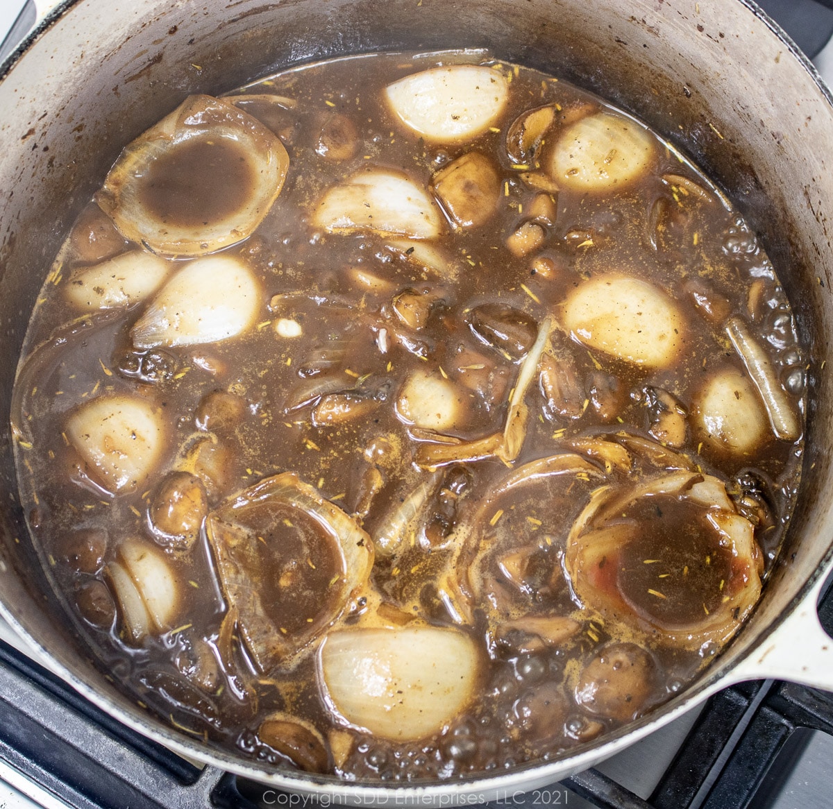 liquids added to vegetables in a Dutch oven for beef stew