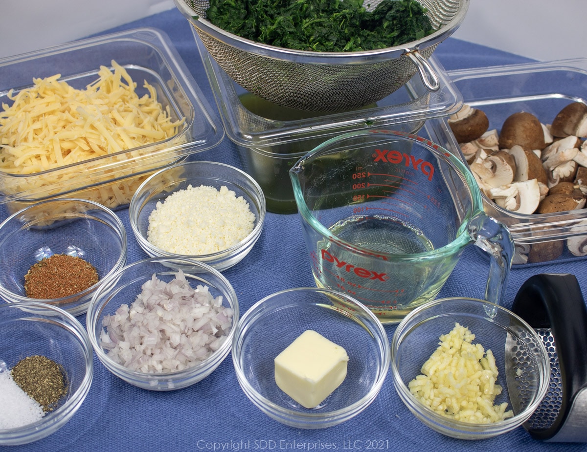 prepared ingredienst layed out for creamy spinach with mushrooms