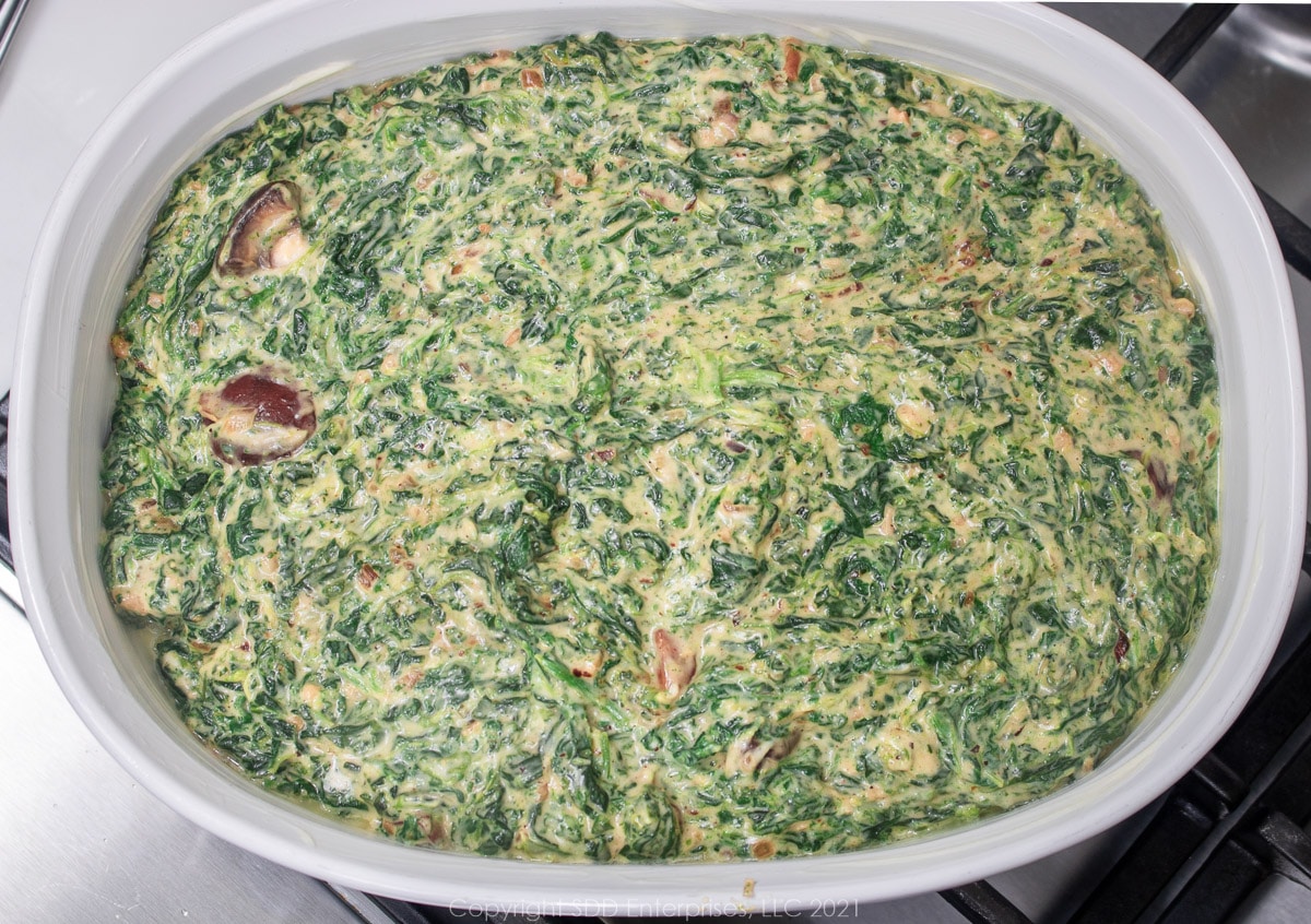 creamy spinach in a baking dish ready for the oven