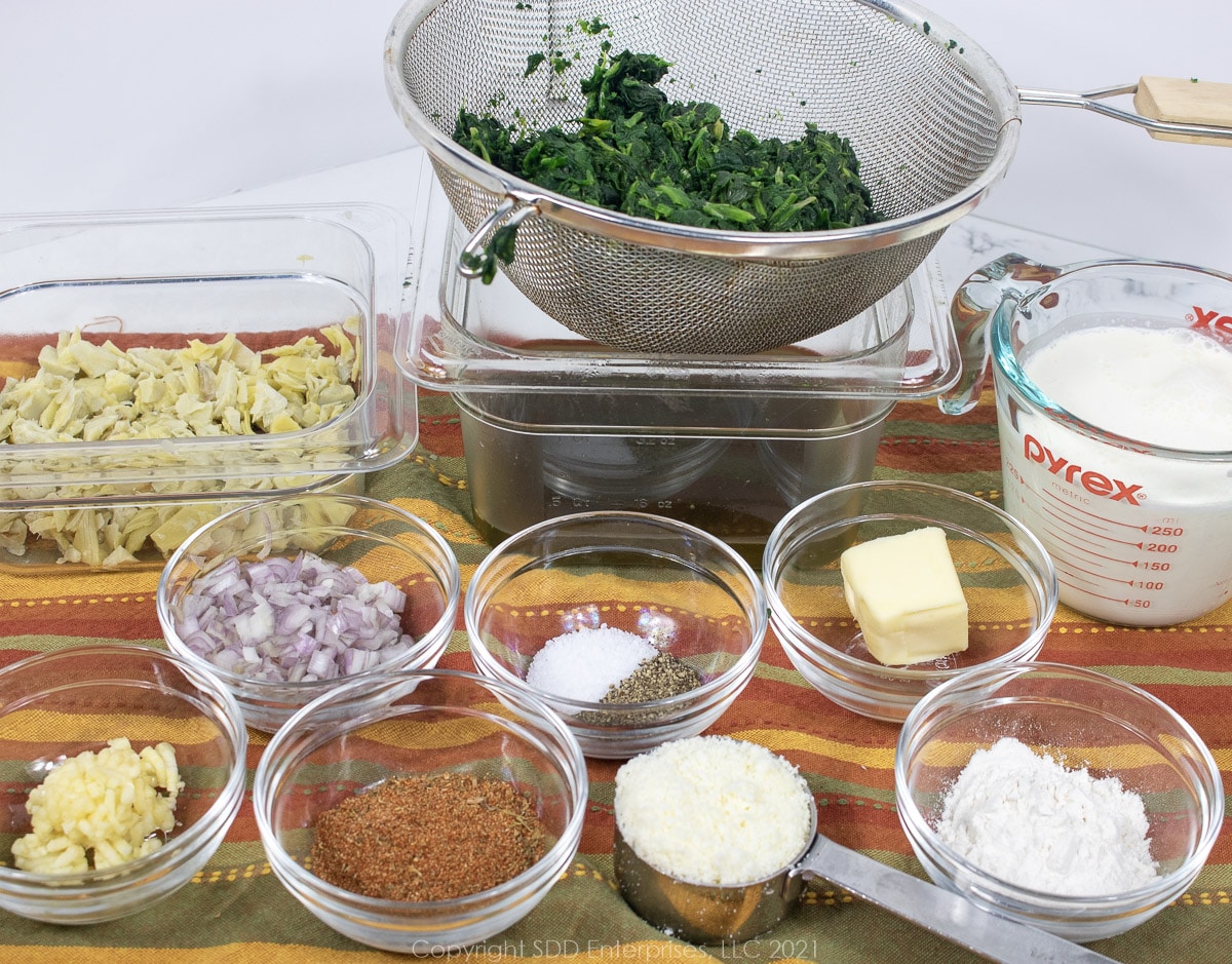 prepared ingredients for creamed spinach and artichoke