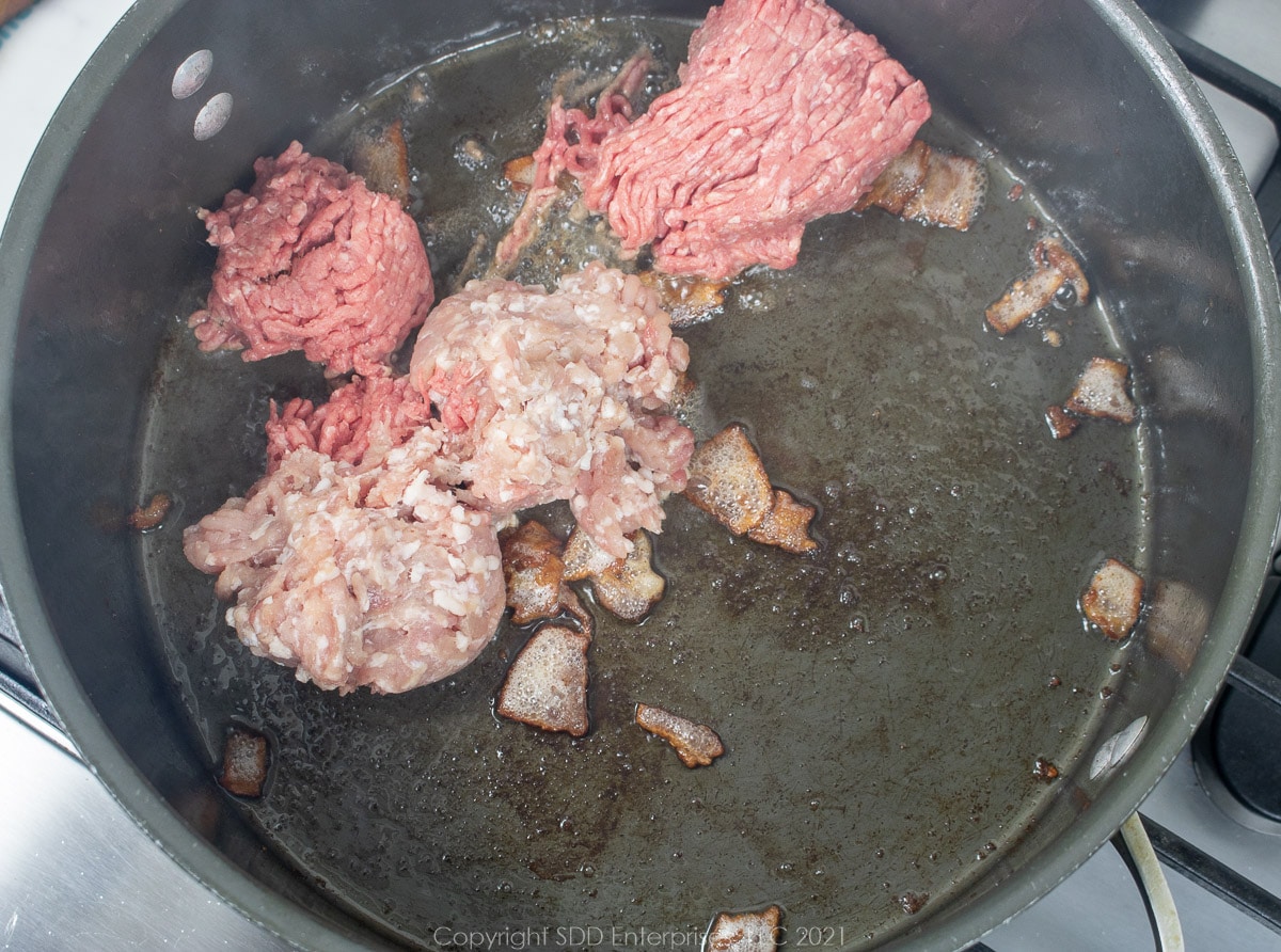 ground beef and pork in a Dutch oven