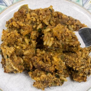 Cajun Eggplant Casserole on a fork over a dish