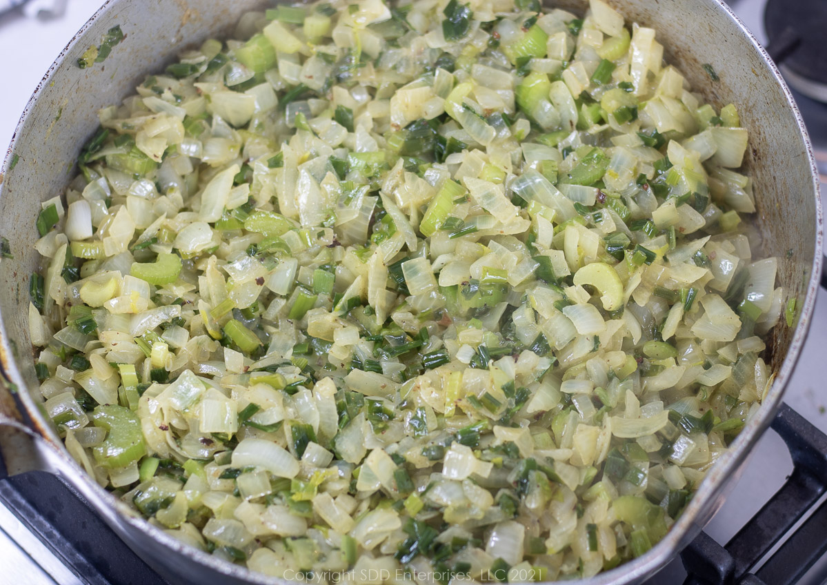 frying onions and celery in butter in a frying pan