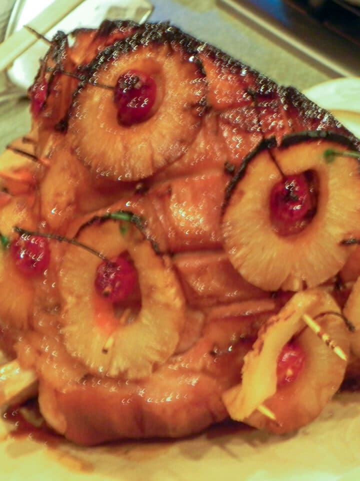 smoked ham with pineapple and cheery garnishment