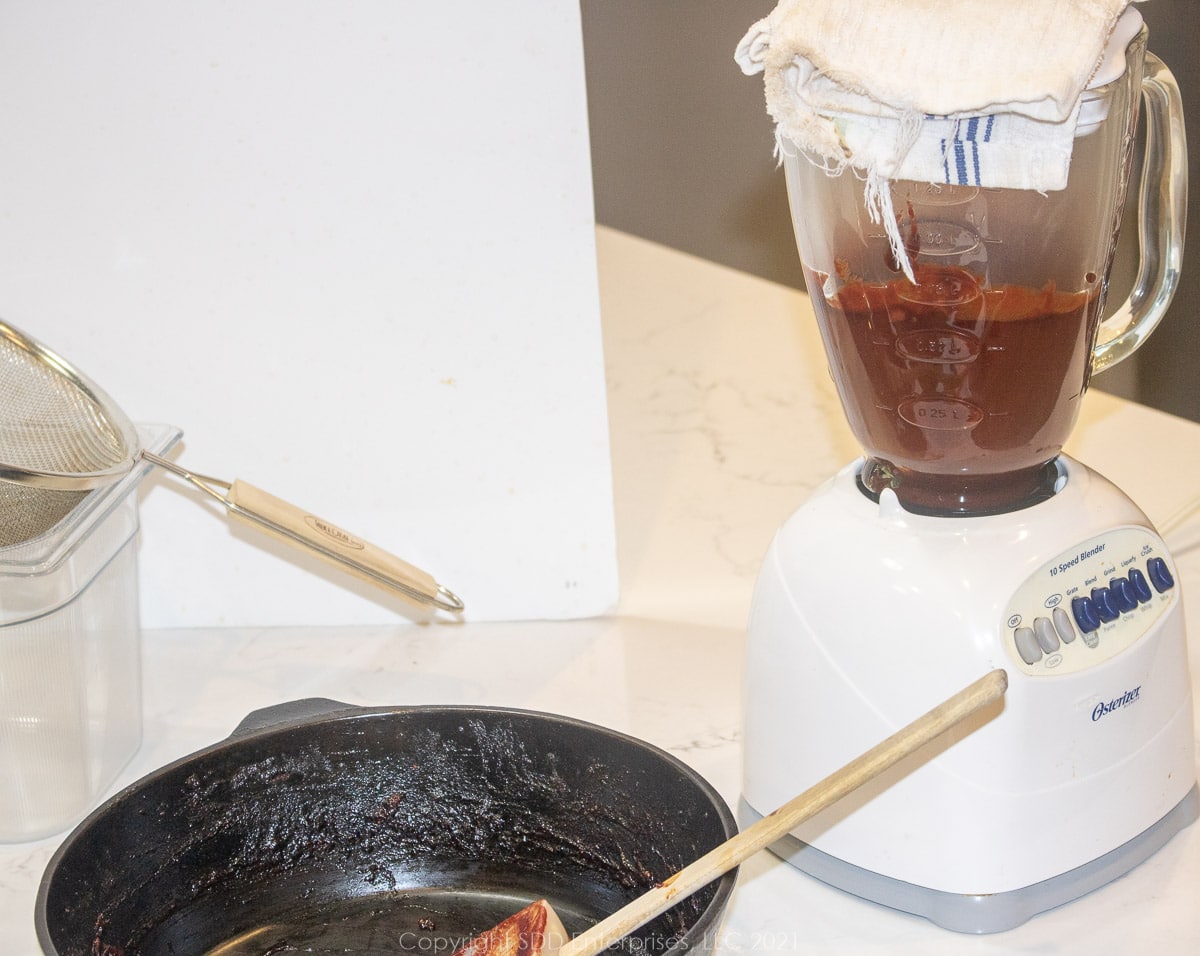 processing bbq sauce through a  blender and strainer