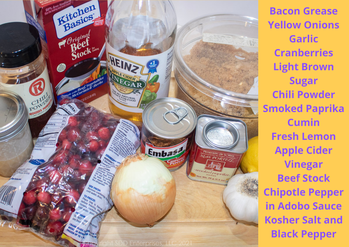 ingredienst for cranberry bbq sauce displayed on a cutting board