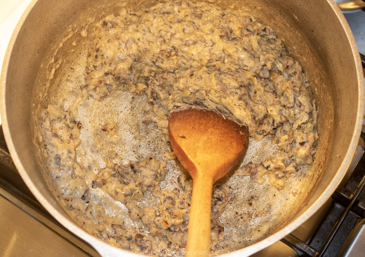 slowly cooking flour veggie mixture in a frying pan