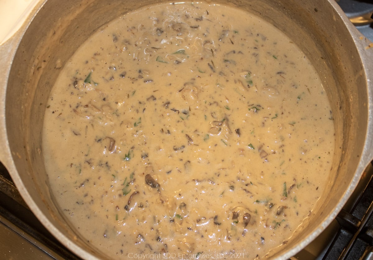 oyster filling simmering in a Dutch oven