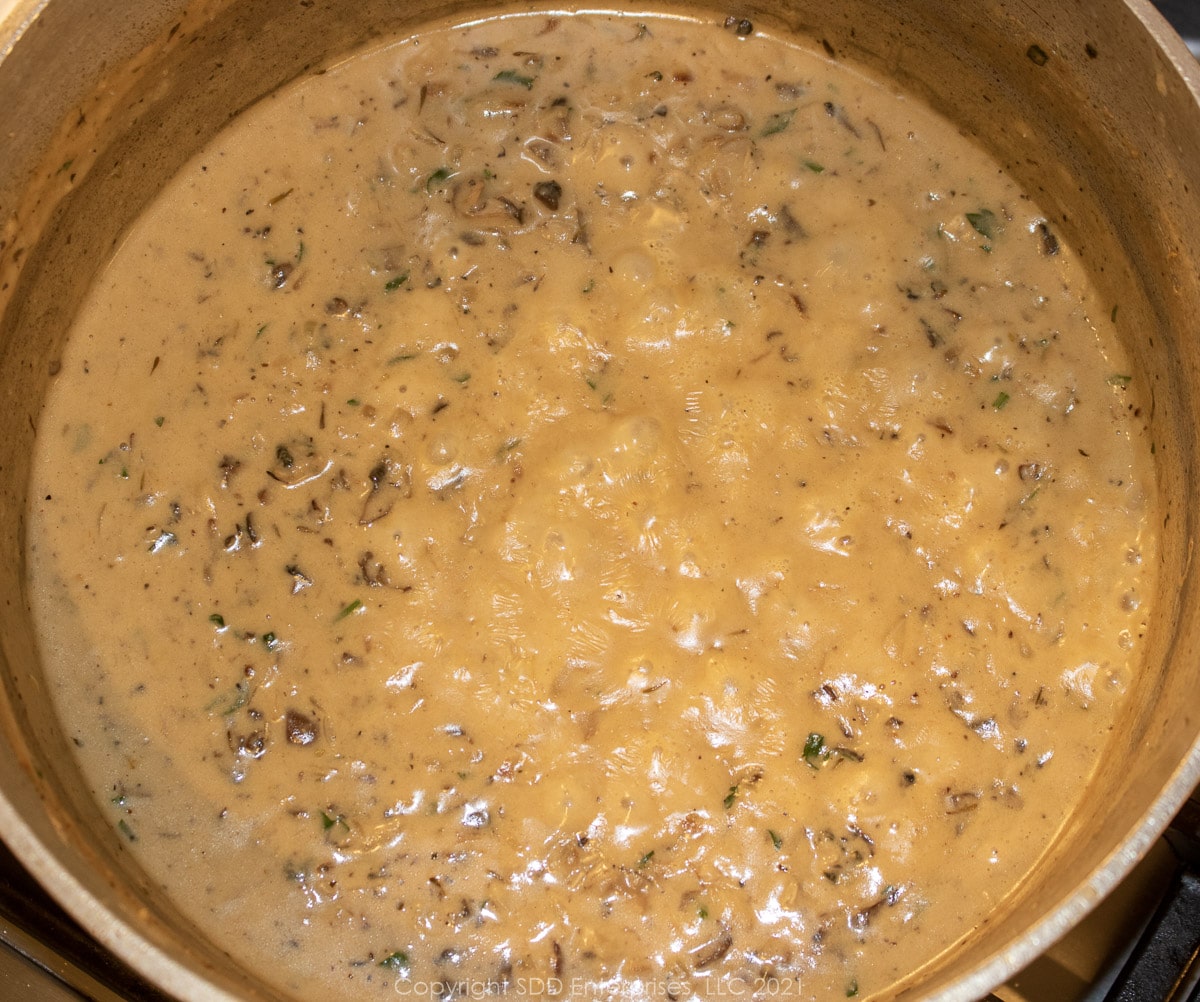 simmering oyster filling in a Dutch oven