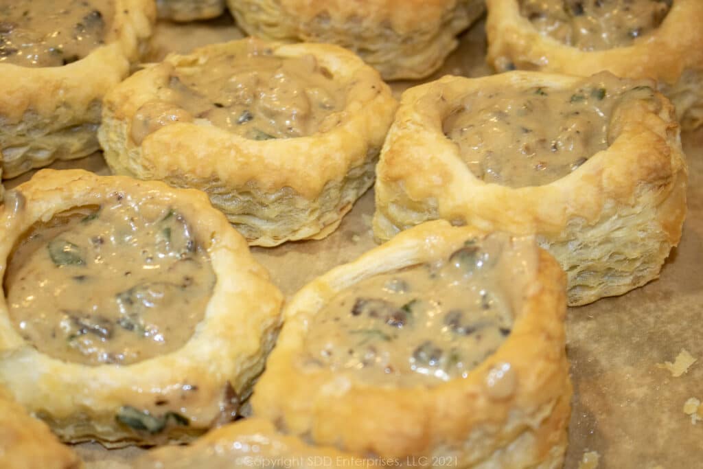 pastry shells filled with oyster sauce ready for the oven