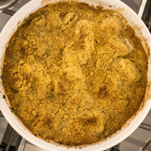 oysters mosca in a round white baking dish