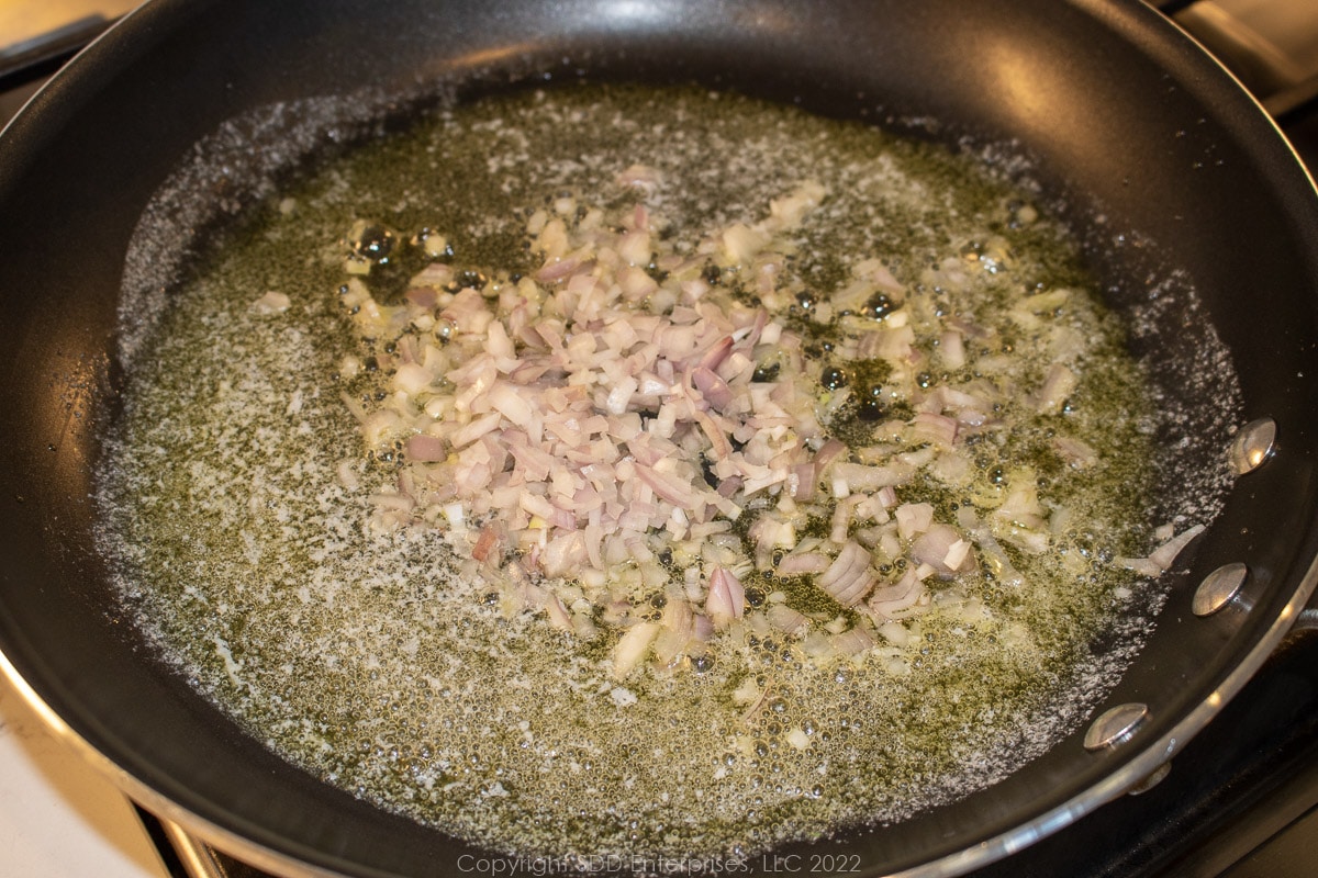 shallots sautéing in a skillet