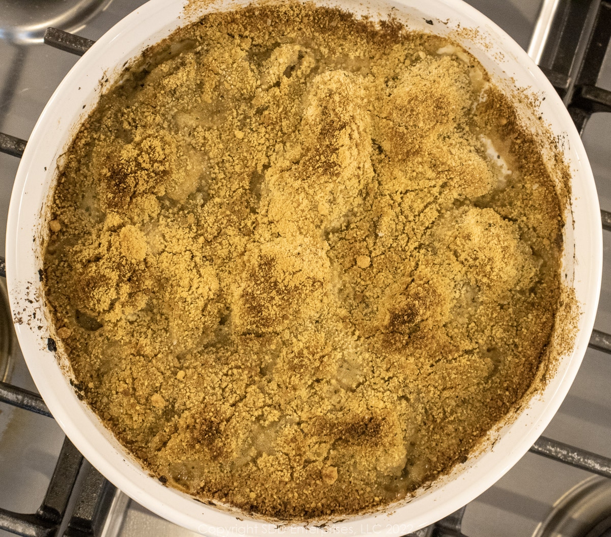 italian baked oysters in a round white baking dish