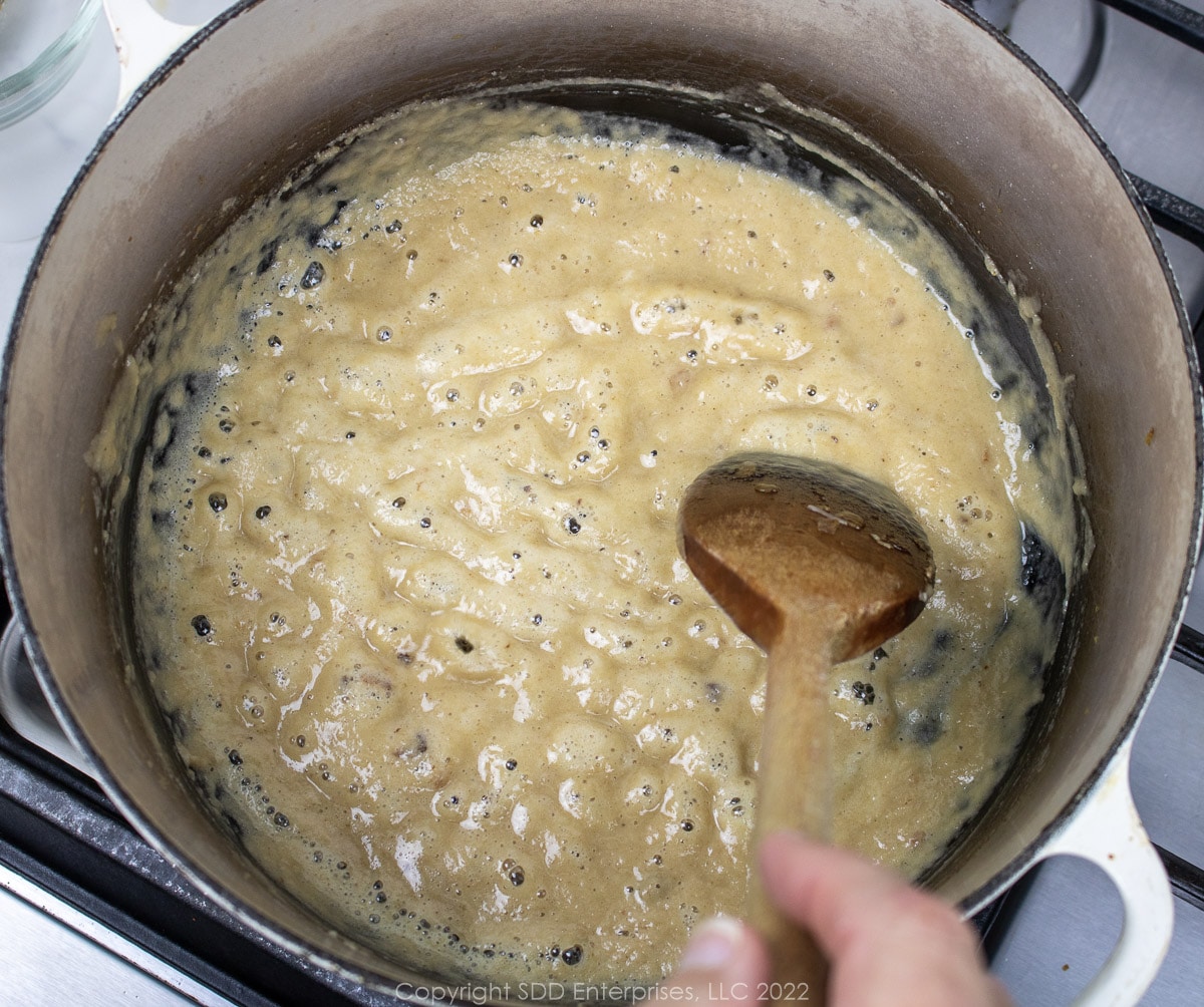light roux with a wooden spoon in a Dutch oven