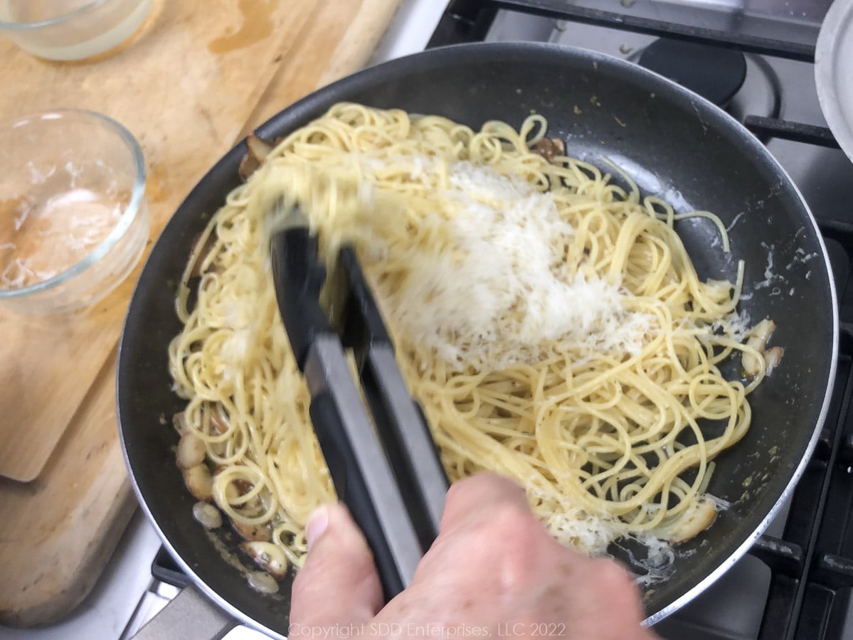 grated parmesan cheese dded to spaghetti and butter sauce