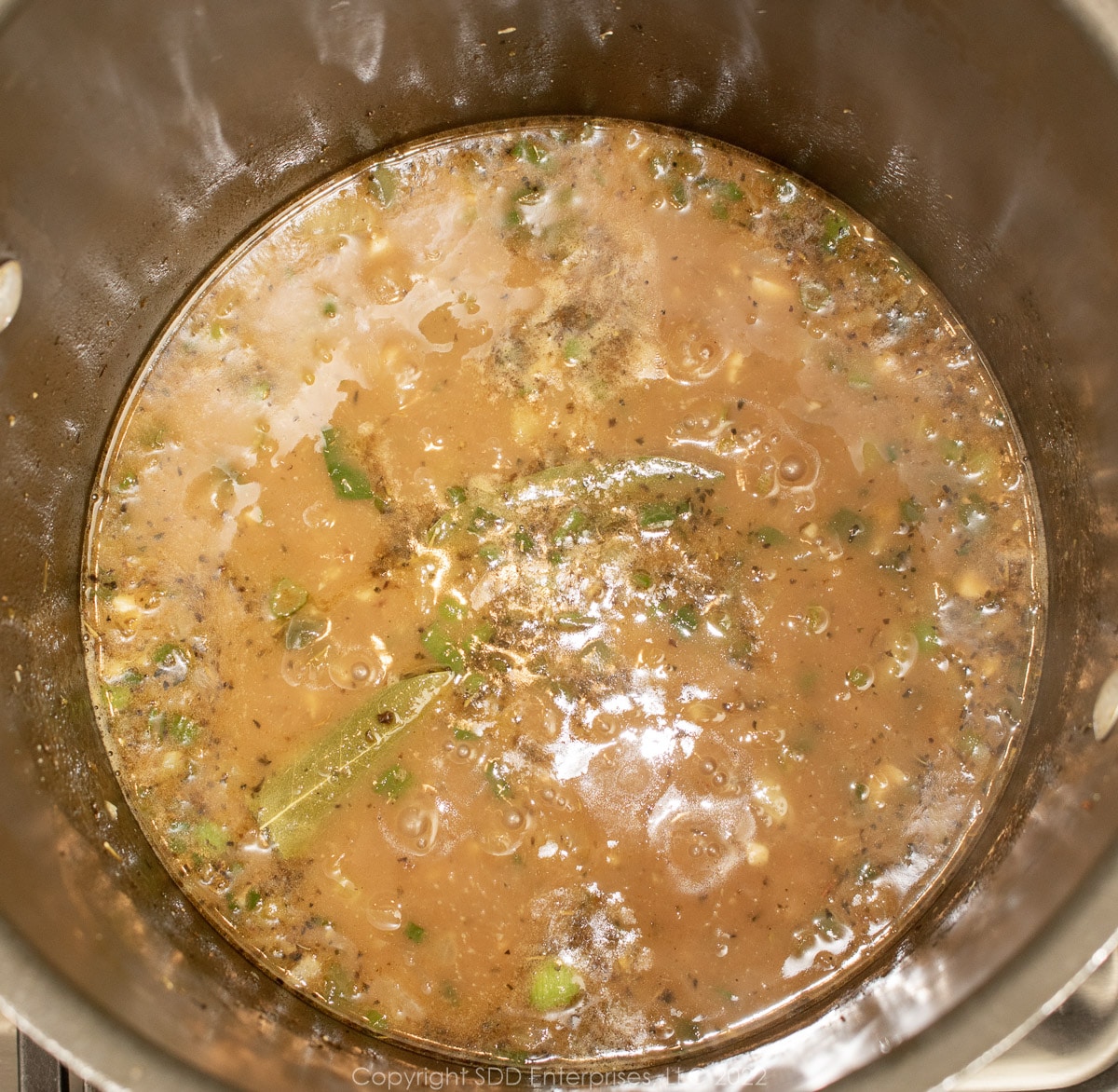 etouffee gravy simmering in a stockpot