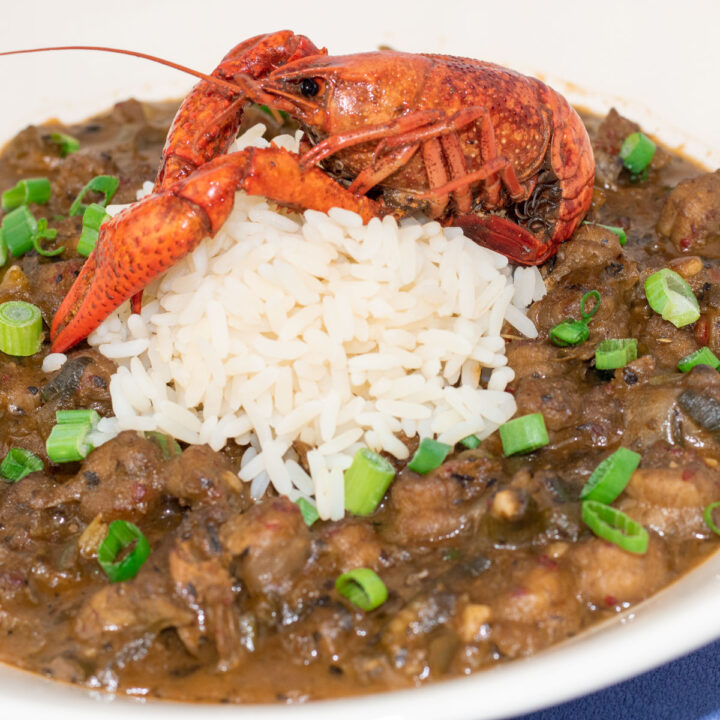 crawfish etouffee with rice and a crawfish garnish