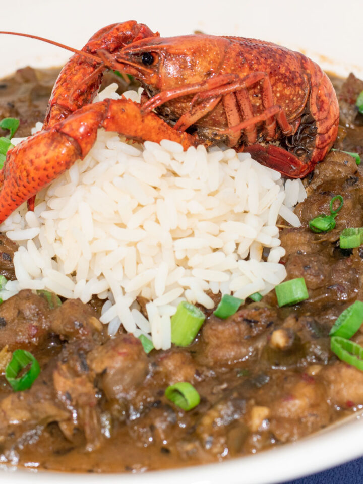 crawfish etouffee with rice and a crawfish garnish