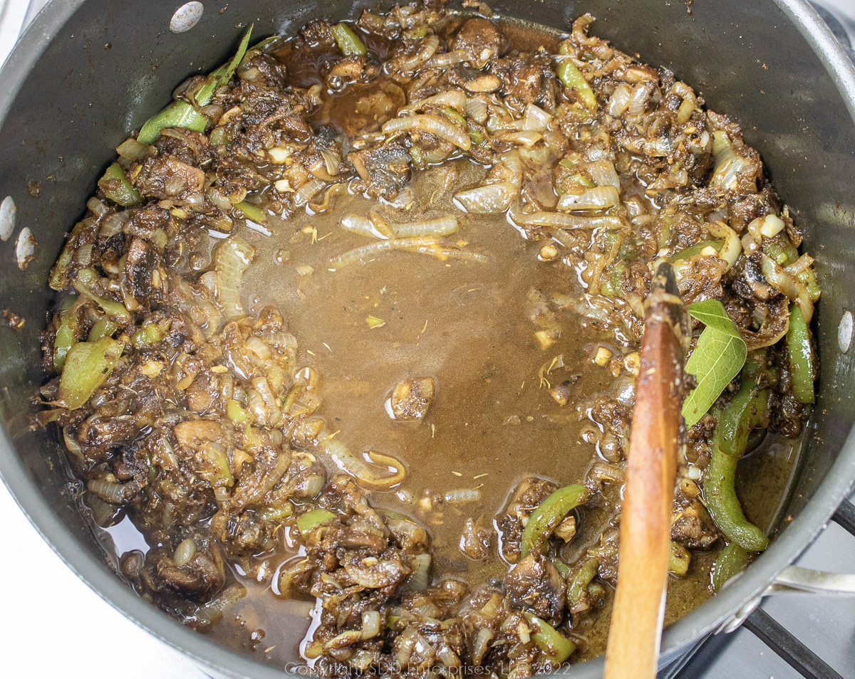 stock added to sautéed vegetables