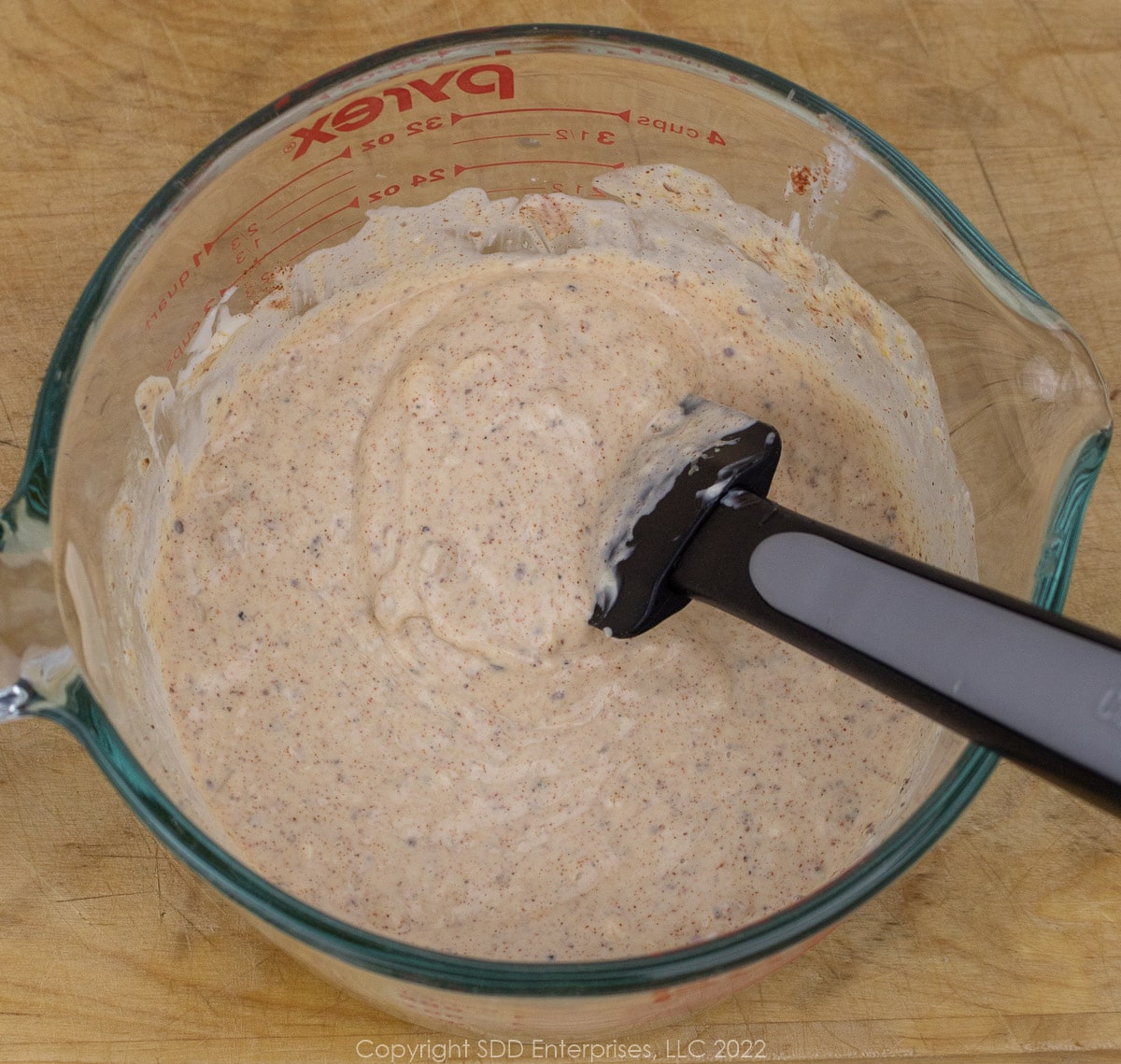 white remoulade sauce in a large measuring cup