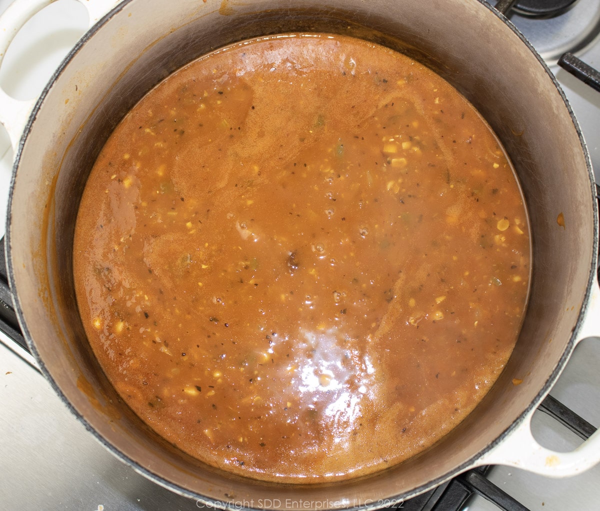 simmering bisque in a Dutch oven