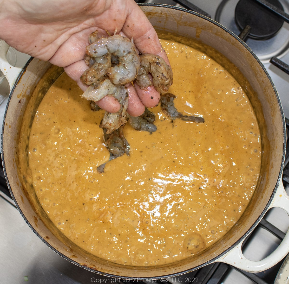 slowly adding shrimp to pureed bisque