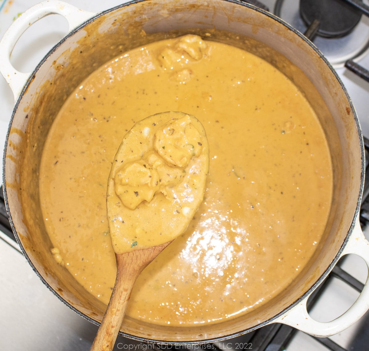 bisque with corn and shrimp in a Dutch oven