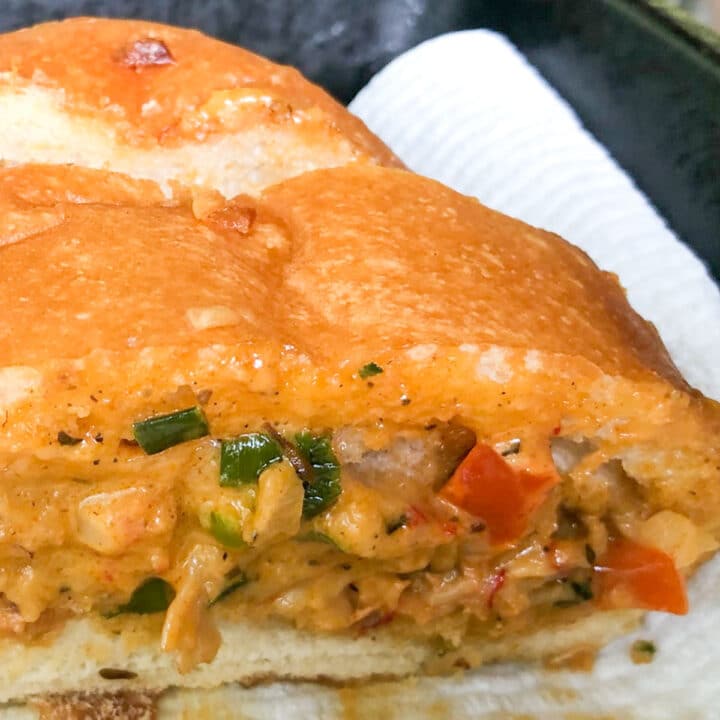 a slice of crawfish bread on a paper towel