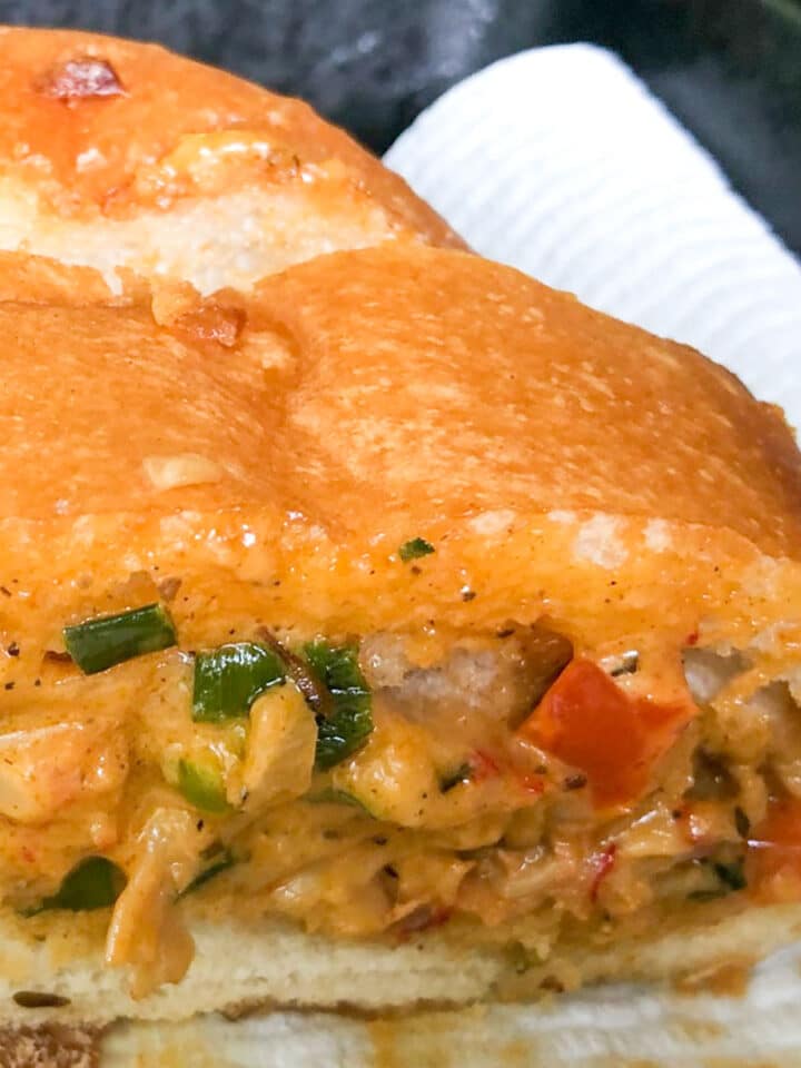 a slice of crawfish bread on a paper towel