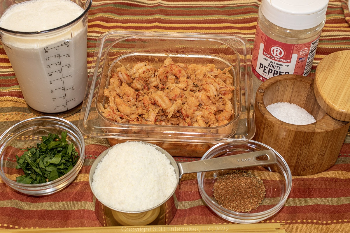 Prepared ingredients for crawfish fettuccini alfredo.