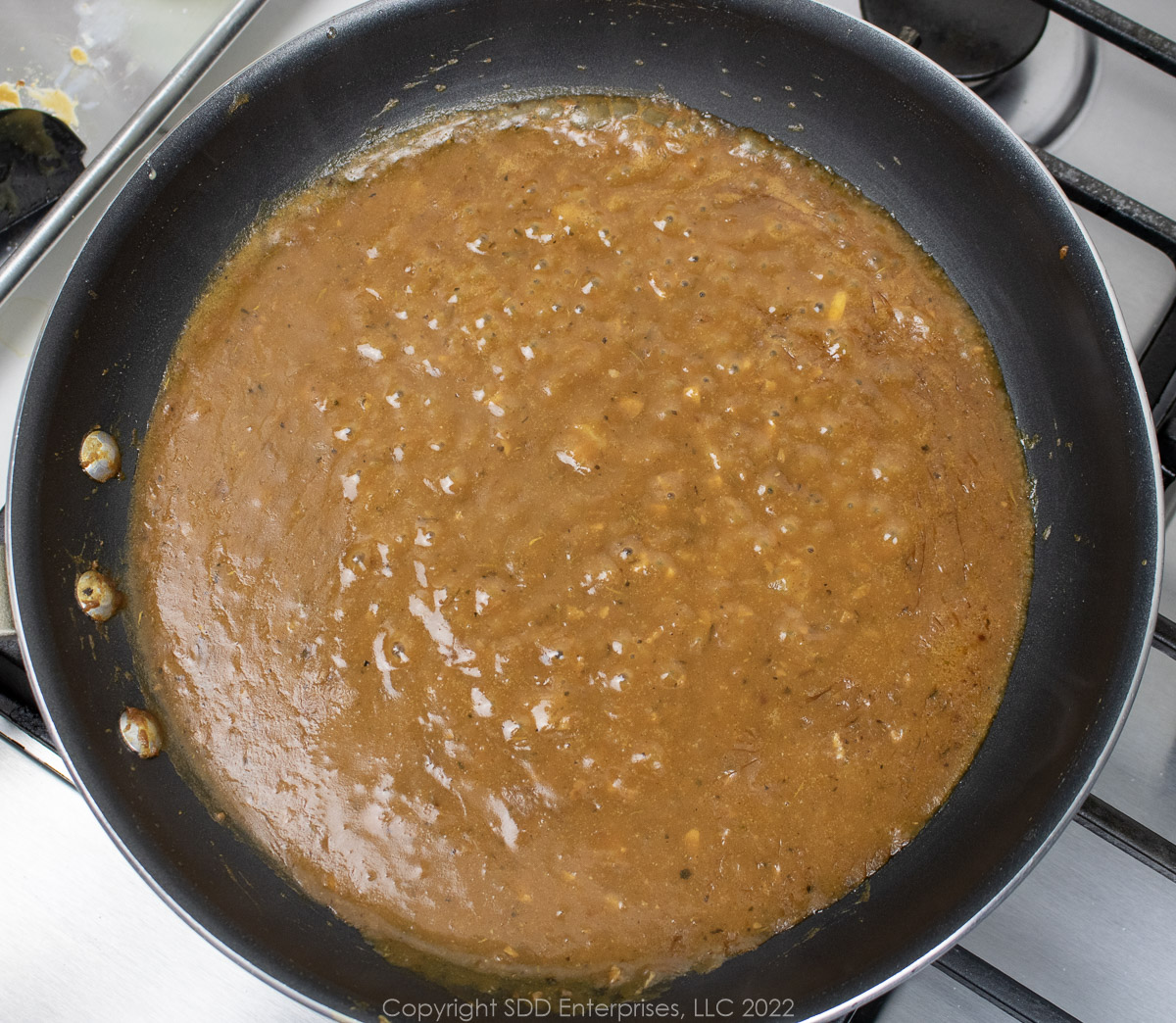 simmering brown gravy in a sauté pam