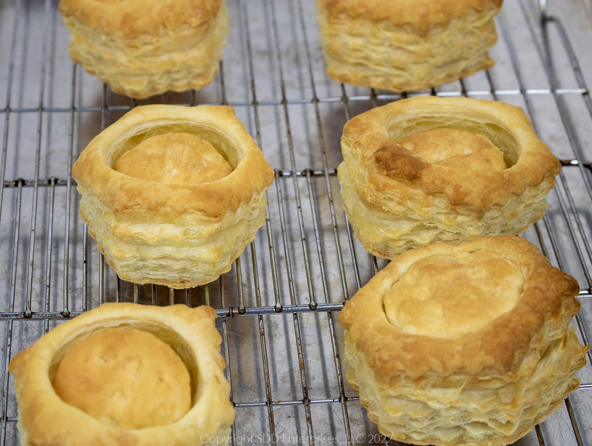 baked pastry shells on a cooling rack