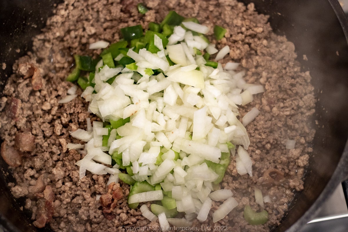 cajun trinity with ground meats in a Dutch oven