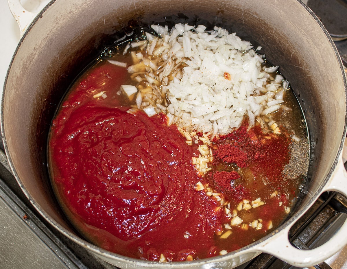 uncooked bq sauce ingredients in a Dutch oven