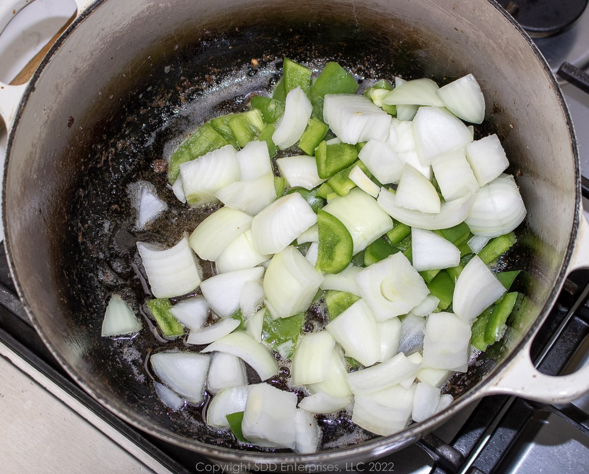 The trinity frying in a Dutch oven