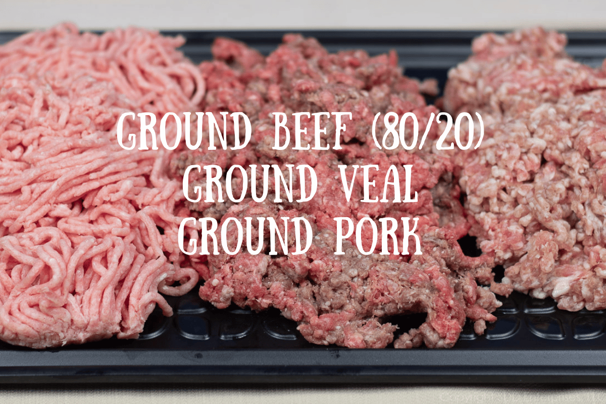  raw ground beef, pork and veal on a black platter