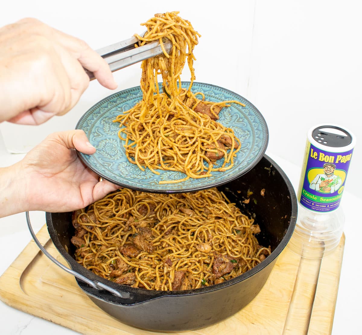 pastalaya being served on a dish from a Dutch oven