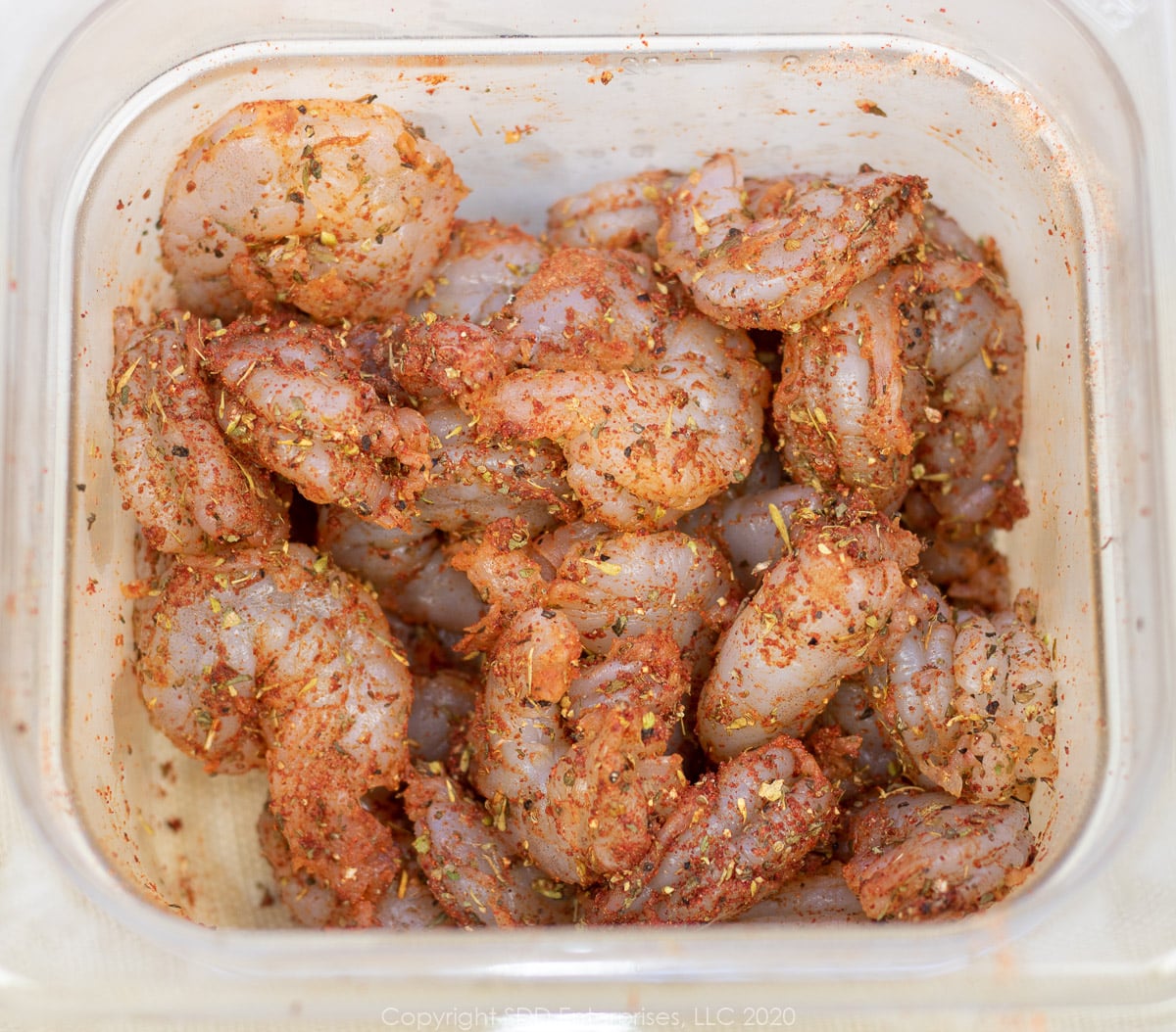 uncooked shrimp with seasoning