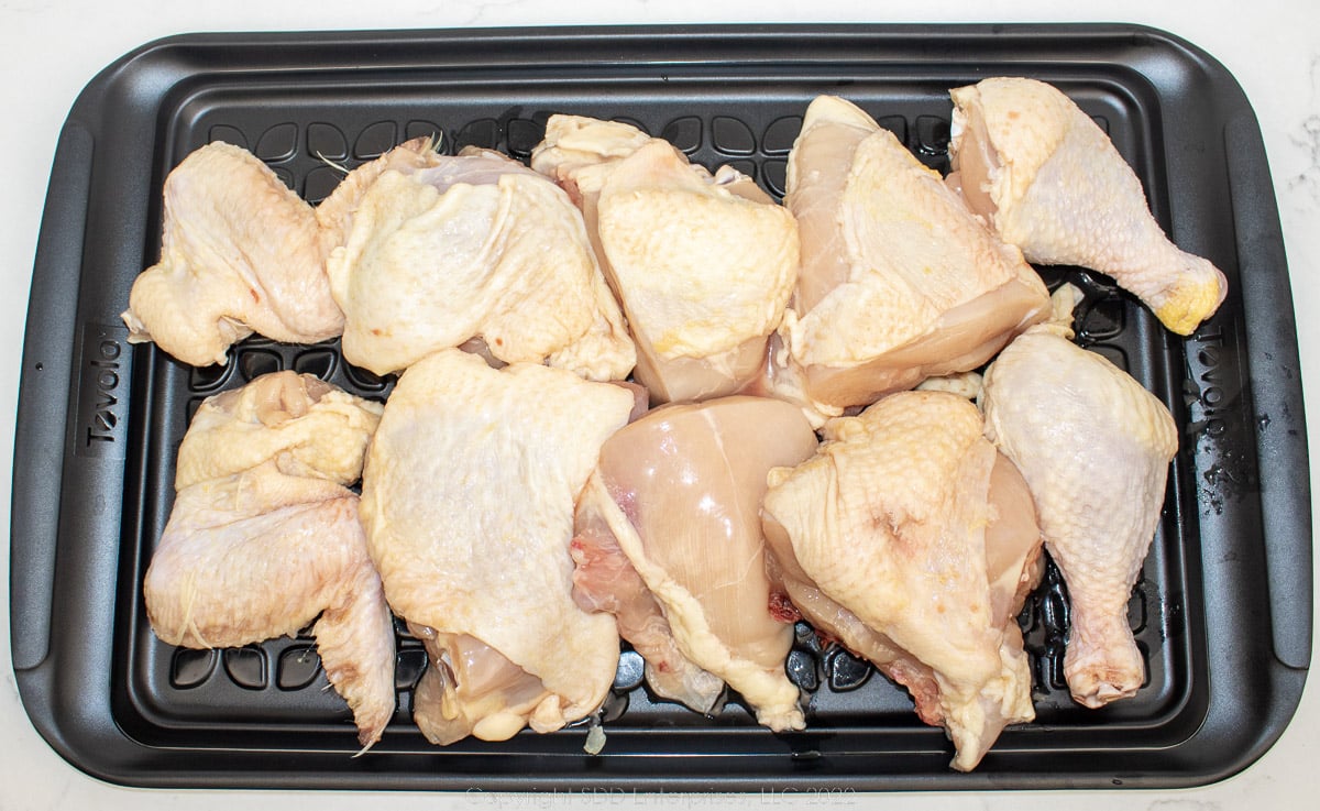 chicken pieces on a prep tray