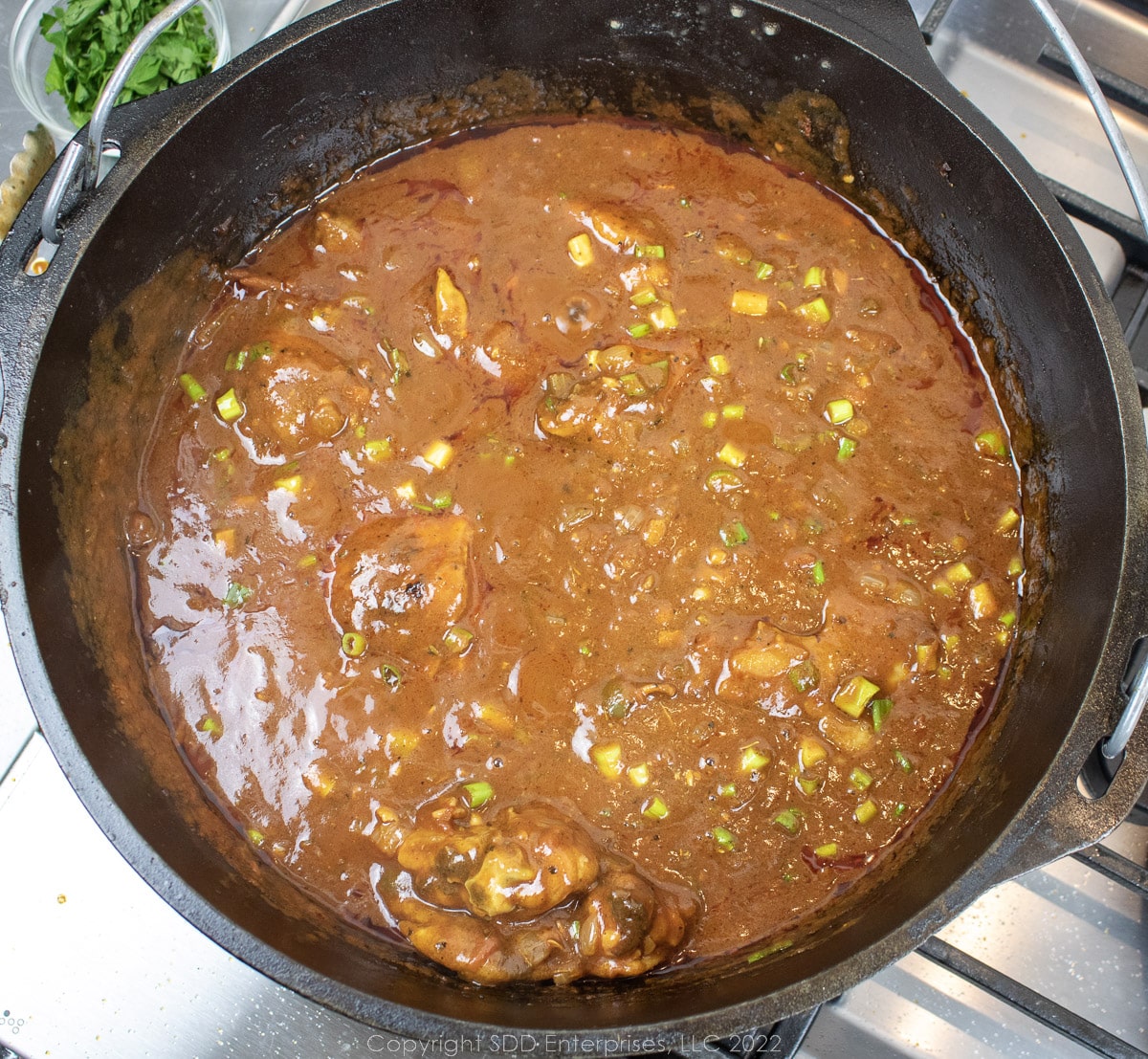 chicken sauce piquant in a Dutch oven