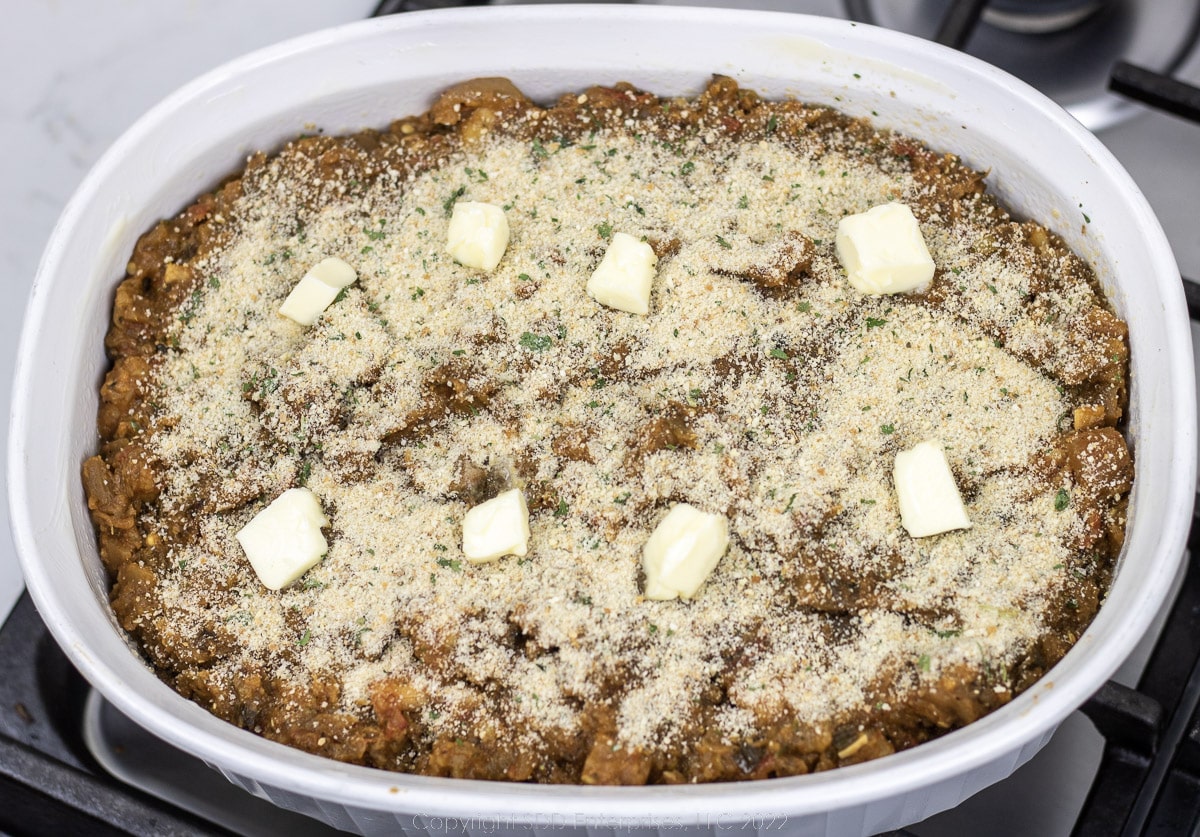 eggplant casserole in a white baking dish ready for the oven