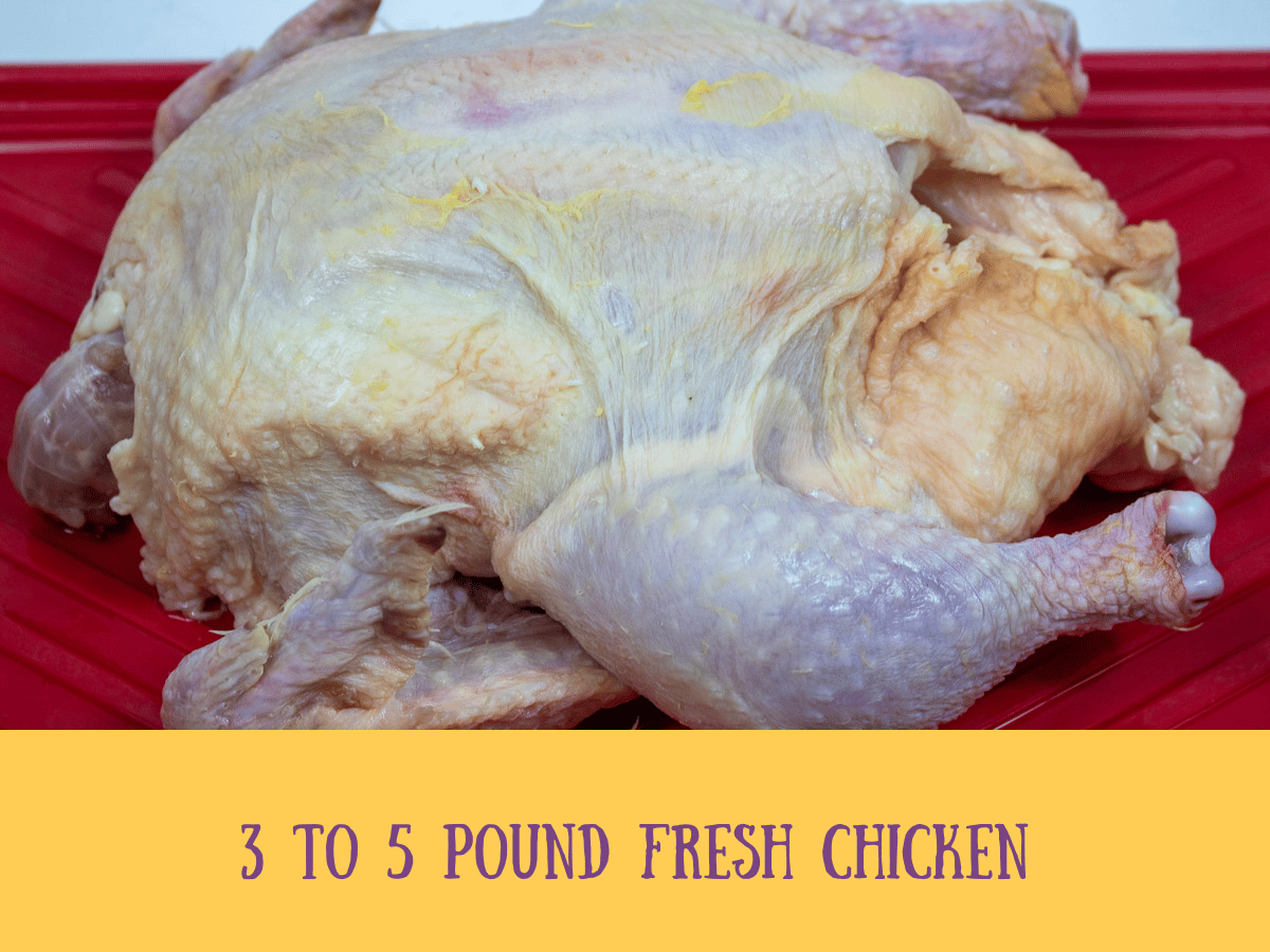 a raw chicken on a prep platter