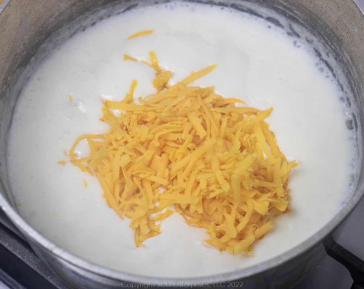 grated cheddar cheese added to a bechamel sauce