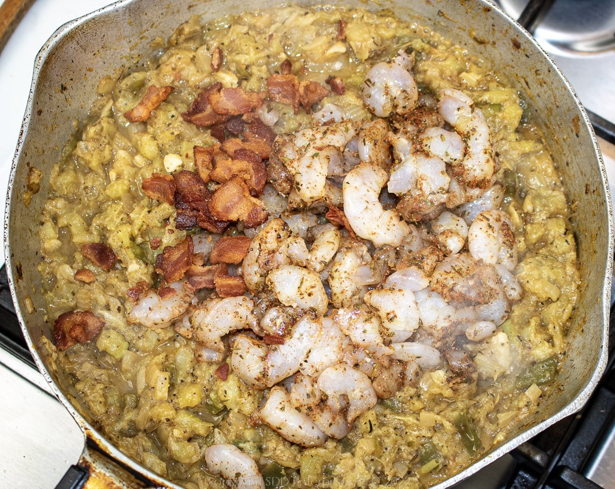 seasoned shrimp added to simmering vegetables