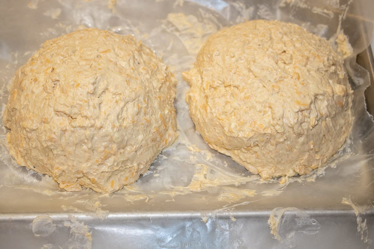 two small cheese balls on a tray