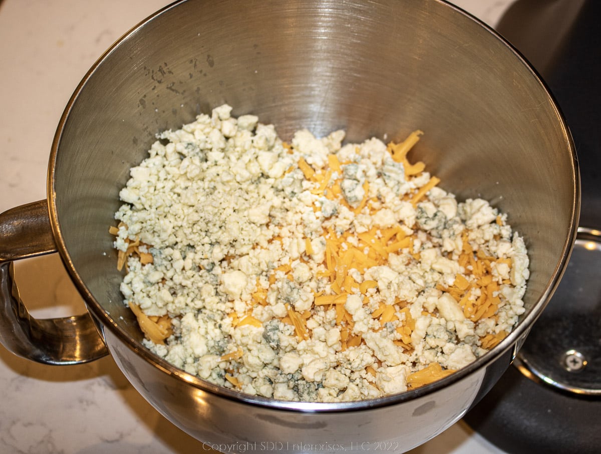 mixed cheeses in a mixing bowl