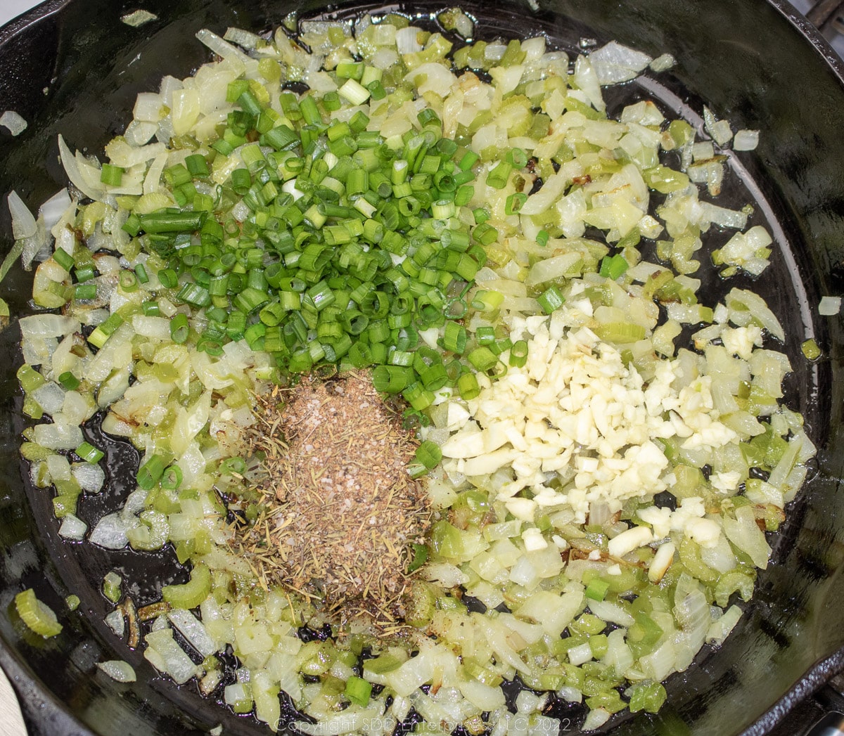 frying the trinity and aromatics in a cast iron skillet