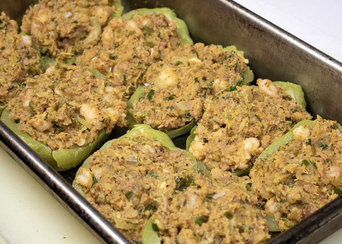 stuffed mirlitons in a baking dish