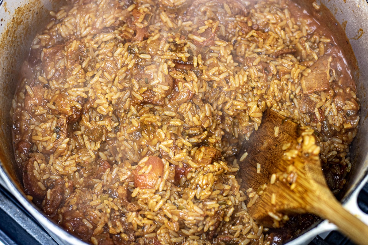 rice cooking in a stock in a Dutch oven